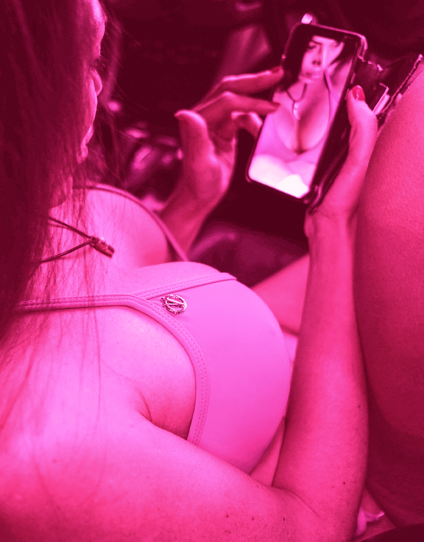 Girl lying down with a gold patteen behind her